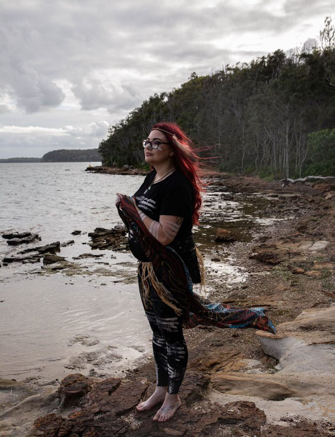 Leticia overlooking a body of water during ceremony